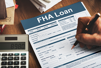 Man signing an fha loan application